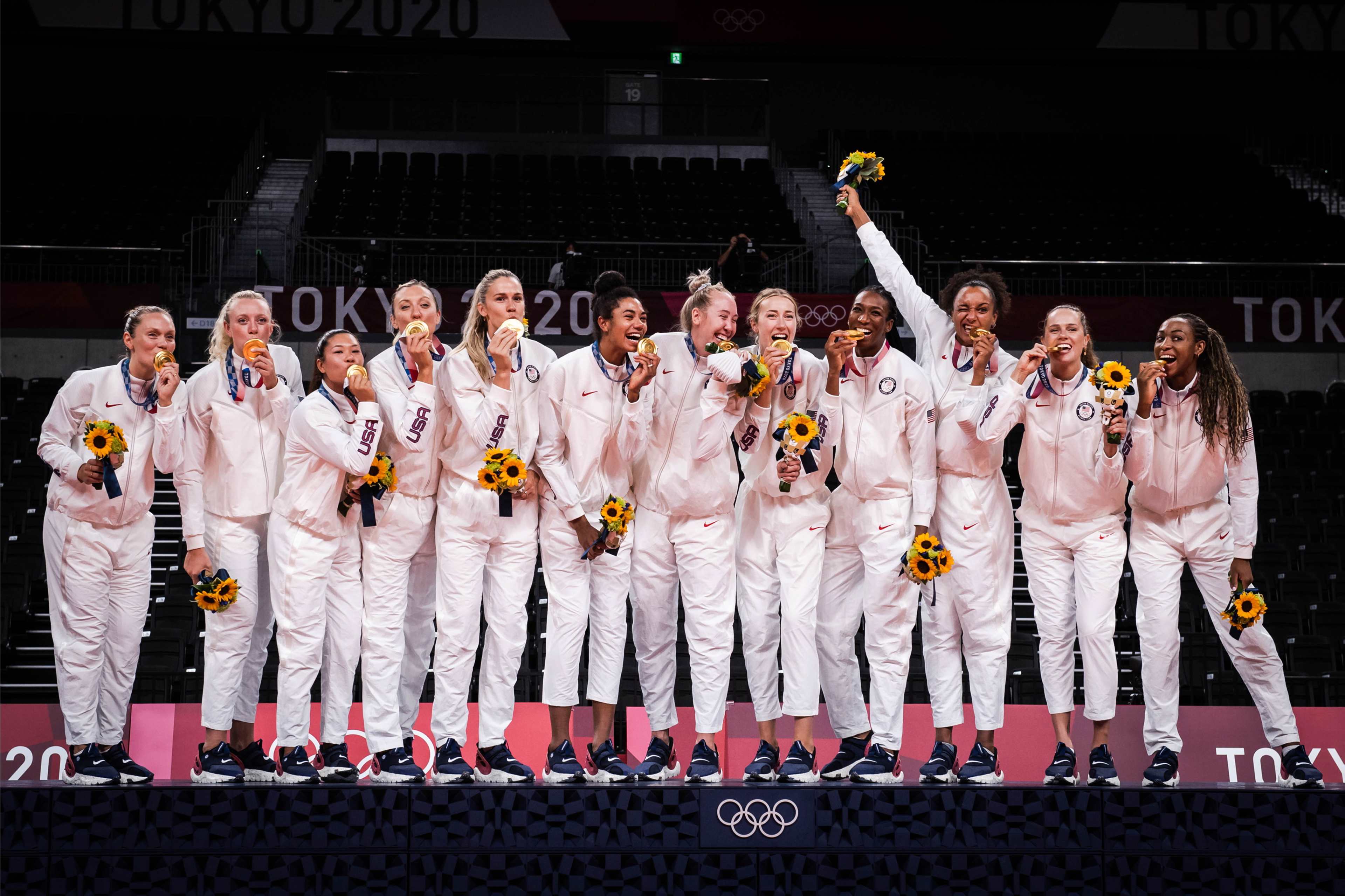 United States women's volleyball team celebrating Olympic gold